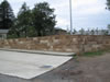 Hydrosplit sandstone block retaining wall with bullnose coping course
